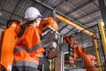 Technician engineer women test control operate inspection robot arm installation in factory. - PhotoDune Item for Sale