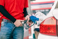 Closeup gas station staff worker hand holding fuel nozzle for refill car fuel, Petroleum business - PhotoDune Item for Sale