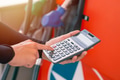 Closeup gas station staff worker hand calculator calculate price car fuel cost, Petroleum business - PhotoDune Item for Sale