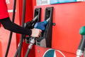 Closeup gas station staff worker hand holding fuel nozzle for refill car fuel, Petroleum business - PhotoDune Item for Sale