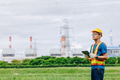 Professional engineer male with coal power plant, Power station with green nature background - PhotoDune Item for Sale