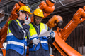 African with American Professional Team Workers in Industry with Safety Uniform and Hard Hat - PhotoDune Item for Sale
