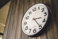Time Clock hanging at modern wooden wall background, business times, office working hours concept. - PhotoDune Item for Sale