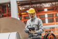 Senior staff worker in heavy industry, healthy elderly supervisor man work in metal sheet factory - PhotoDune Item for Sale