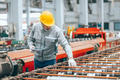 Professional senior Industrial worker in protective helmet and uniform service machinery in factory - PhotoDune Item for Sale