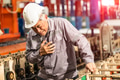 Senior factory worker chest pain suffering from heart attack, heart fail sign expression at work - PhotoDune Item for Sale