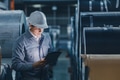 Professional engineer man working in heavy metal industry checking metal sheet roll with attention - PhotoDune Item for Sale
