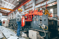 Professional senior Industrial worker in protective helmet and uniform service machinery in factory - PhotoDune Item for Sale