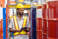 African black male worker working check in chemicals storage in petrochemical oil gas plant factory - PhotoDune Item for Sale