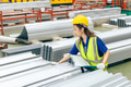 Young Asian woman engineer worker, professional employee working in metal sheet plant factory - PhotoDune Item for Sale