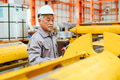 Professional senior worker, High skill expert Japanese machine operator work in industry factory. - PhotoDune Item for Sale