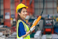 Young Asian woman engineer worker happy smiling professional working in heavy industry plant factory - PhotoDune Item for Sale