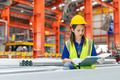 Young Asian woman engineer worker, professional employee working in metal sheet plant factory - PhotoDune Item for Sale