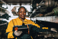 Happy Black African women engineer worker enjoy working in old used machine part stock warehouse. - PhotoDune Item for Sale
