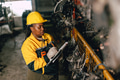African black women engineer worker working in old used machine part stock warehouse. - PhotoDune Item for Sale
