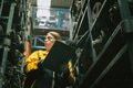Technician adult women worker working in heavy industry, warehouse manager in garage scrap yard - PhotoDune Item for Sale