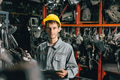 portrait young Caucasian technician worker working in heavy industry, looking camera happy smiling - PhotoDune Item for Sale