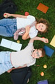 Happy children lying on grass relaxing after school - PhotoDune Item for Sale