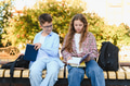 Schoolchildren studying books outdoors on school campus - PhotoDune Item for Sale