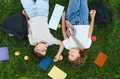 Two students relaxing enjoying friendship outdoors in park - PhotoDune Item for Sale