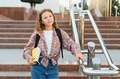 Schoolgirl with books standing on campus stairs - PhotoDune Item for Sale
