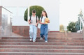 School children friends walking down campus stairs together - PhotoDune Item for Sale
