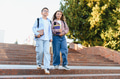 Schoolchildren walking down stairs together after classes - PhotoDune Item for Sale