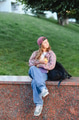 Schoolgirl student resting on campus wall holding apple - PhotoDune Item for Sale