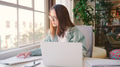 Young Businesswoman Wearing Glasses At Desk Working On Laptop In Modern Office - PhotoDune Item for Sale