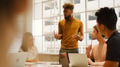 Young Multi Cultural Business Team Meeting Around Table In Modern Office - PhotoDune Item for Sale