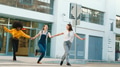 Three Young Smiling Female Friends Outdoors Holding Hands On Crosswalk In City - PhotoDune Item for Sale