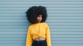 Portrait Of Cool Young Woman Outdoors Leaning Against Blue Shutter - PhotoDune Item for Sale