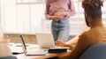 Close Up Of Young Multi Cultural Business Team Meeting Around Table In Modern Office - PhotoDune Item for Sale
