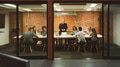 Mature Businessman Standing And Leading Office Meeting Around Table - PhotoDune Item for Sale