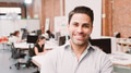 Portrait Of Mature Businessman In Modern Open Plan Office With Business Team Working In Background - PhotoDune Item for Sale