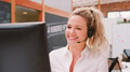 Portrait Of Female Customer Services Agent Working At Desk In Call Center - PhotoDune Item for Sale