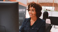 Mature Female Customer Services Agent Working At Desk In Call Center - PhotoDune Item for Sale