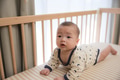 Baby turning and crawling on bed - PhotoDune Item for Sale