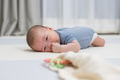Newborn baby lying on soft play mat - PhotoDune Item for Sale