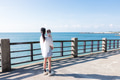 Woman hold baby and look ocean - PhotoDune Item for Sale