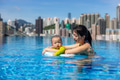 Mom and baby swim in the pool - PhotoDune Item for Sale