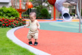 Little baby enjoying outdoor playtime in sunny park - PhotoDune Item for Sale