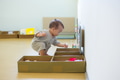 Little baby playing happily inside colorful playhouse - PhotoDune Item for Sale
