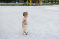 Cute baby stand on sunny stone path - PhotoDune Item for Sale