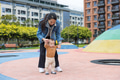Happy mother supporting baby first steps outside - PhotoDune Item for Sale