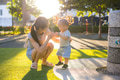 Mother bringing her little son to the park - PhotoDune Item for Sale