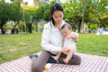 Mum protecting her baby son with sunblock at park - PhotoDune Item for Sale