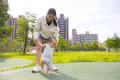 Woman helping toddler take first steps outside together - PhotoDune Item for Sale
