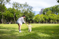 Mum hold her son hand and walk on the grass - PhotoDune Item for Sale