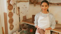 Portrait Of Female Potter Holding Lump Of Clay In Ceramics Studio - PhotoDune Item for Sale